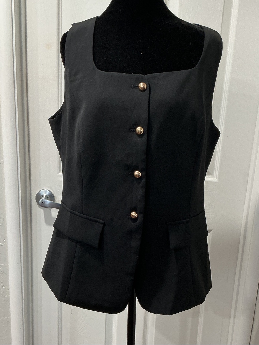 Black Sleeveless Button-Front Vest with Decorative Tag